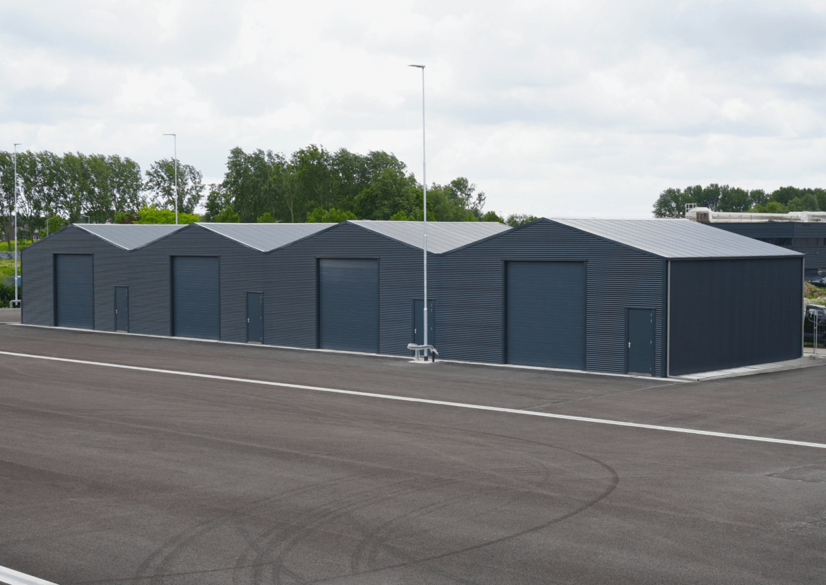 3010 - J11_4.2 - Geschakelde opslagloodsen bij een gemeentewerf