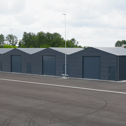 3010 - J11_4.2 - Geschakelde opslagloodsen bij een gemeentewerf